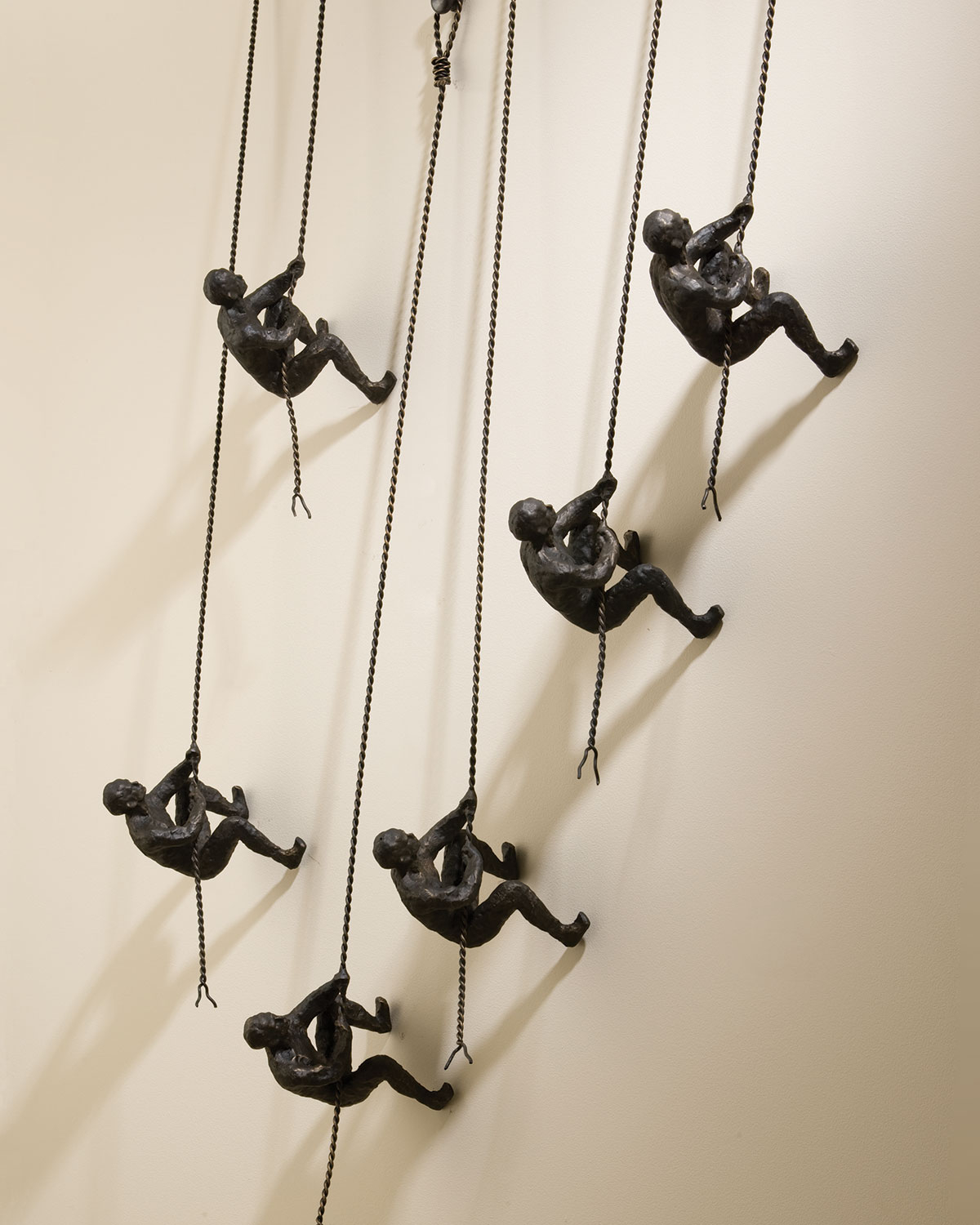 Global Views Climbing Men Wall Decor | Neiman Marcus for Why the Gold Climbing Man Set of 4 Has Become a Modern Interior Design Phenomenon