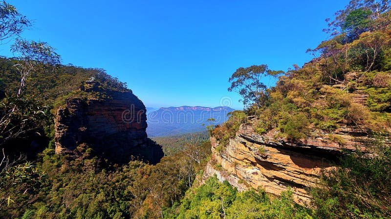 Rugged Sandstone Cliffs And Dense Eucalyptus Forests In The Blue ... in The Artistic Journey Behind Preserving the Vibrant Horizons and Rugged Shores of New South Wales