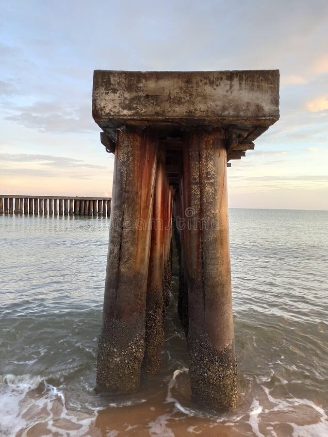 Forgotten Pier Column Under Beatiful Skies Stock Photo - Image Of Shore ... for The Quiet Beauty of Forgotten Piers in Modern Art