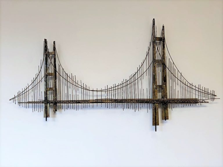 How Handmade Iron Sculptures Bring Golden Gate Bridge History to Life on Wooden Walls